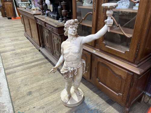 Neoclassical style resin statue of man holding torch