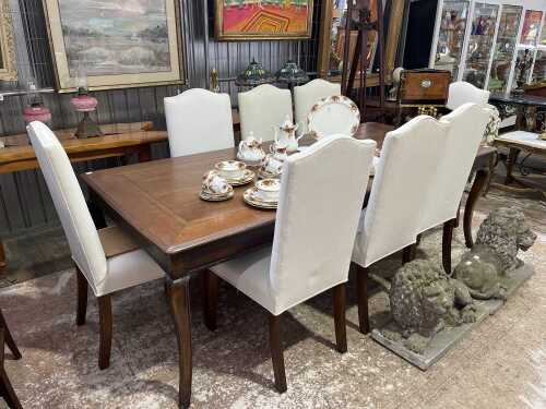 A French style nine piece dining suite