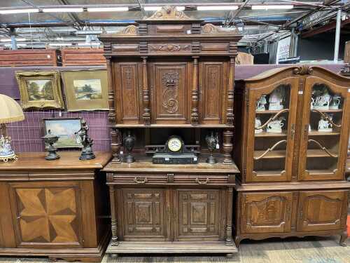 An antique French oak court cabinet