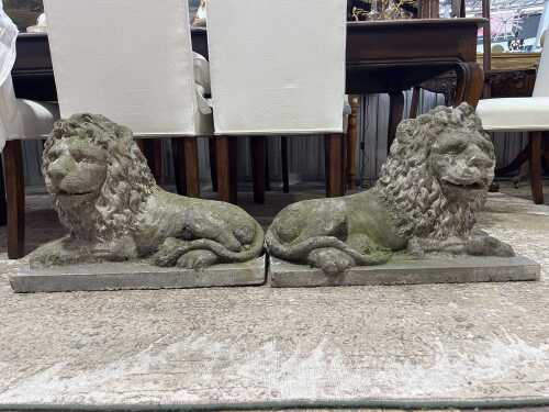 Pair of antique concrete reclining lion figures