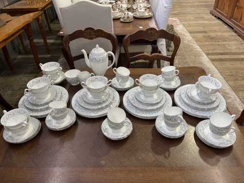 A Wedgwood Dolphins porcelain dinner setting for 12