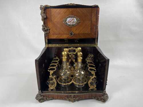 An antique French Rococo style liqueur set