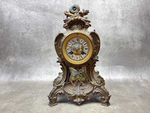 A 19th century gilt spelter mantel clock with hand painted porcelain dial and mounts