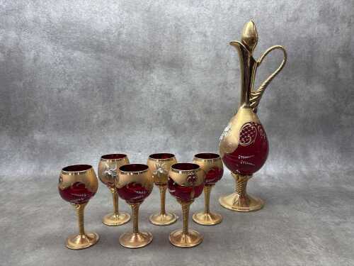 A Venetian ruby glass seven piece drinks set