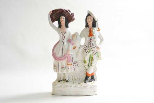 A Stafford Highland couple ceramic flatback figure