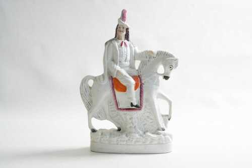 A Staffordshire ceramic flatback figure of man on horse