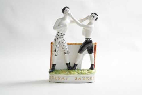 An old style Staffordshire John Heenan and Tom Sayers bare-knuckle boxing ceramic figure