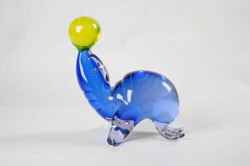 An art glass blue seal figure with uranium glass ball