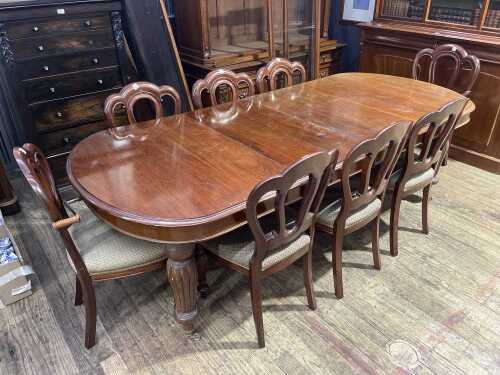 A reproduction mahogany nine piece dining suite
