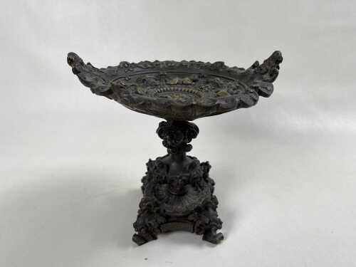 An antique cast bronze footed dish decorated with cherubs