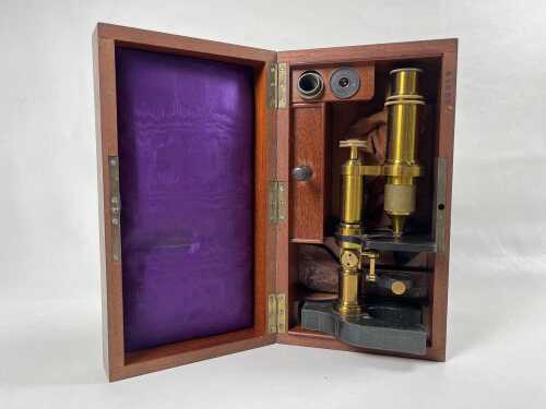 Antique brass microscope in fitted mahogany case