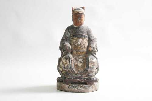 An antique Chinese carved giltwood seated figure