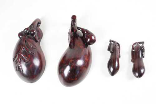 Three Chinese carved timber pear shaped boxes