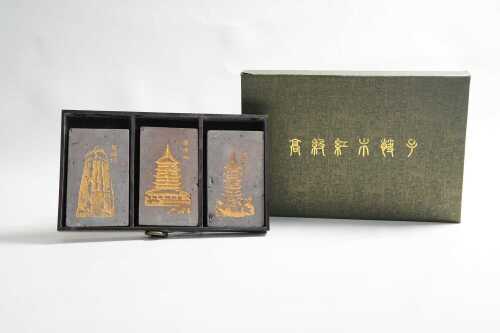 Three Chinese decorative blocks in timber tray