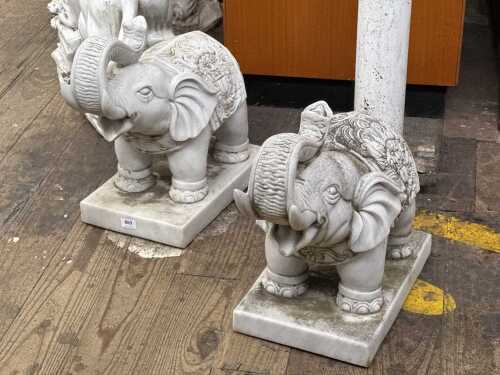 Pair of carved marble elephant statues