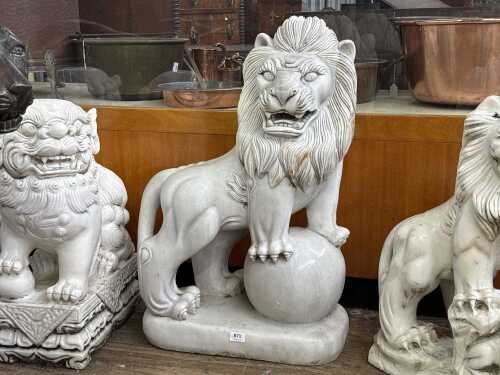 A carved marble lion statue