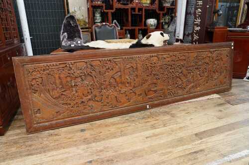 A large Oriental carved timber panel
