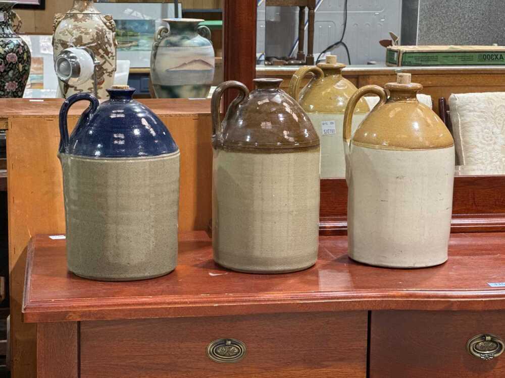 Three stoneware demijohns