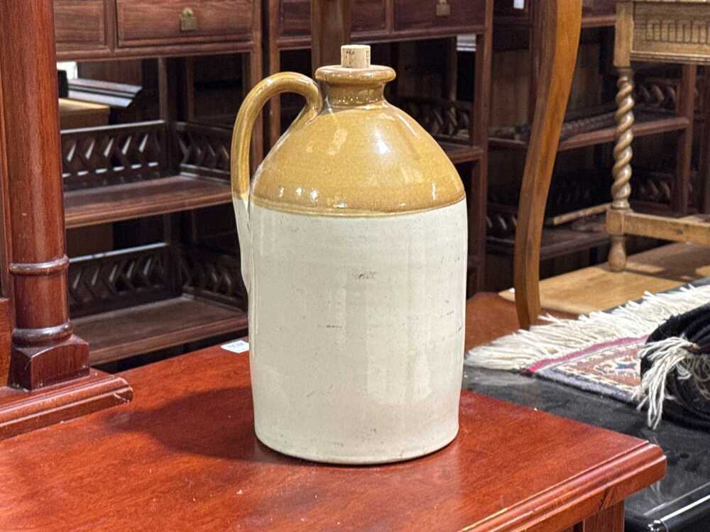 Three stoneware demijohns