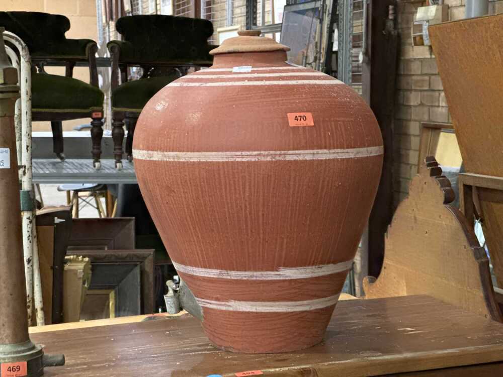 Unglazed terra cotta tapayan jar water dispenser