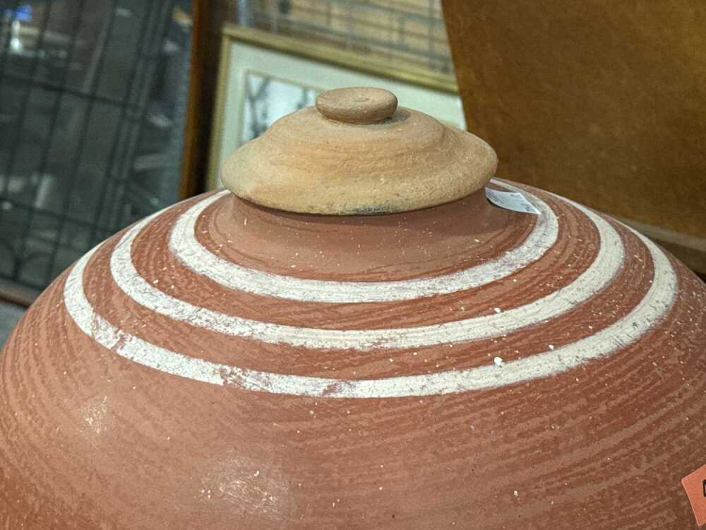 Unglazed terra cotta tapayan jar water dispenser