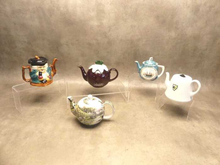 A group of tea pots